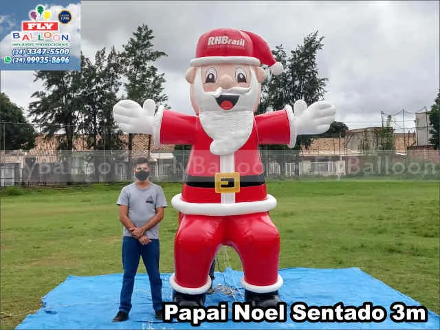 papai noel inflável gigante promocional sentado rhbrasil